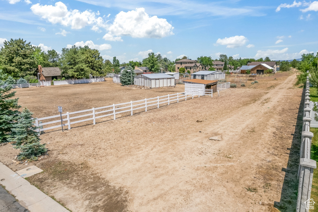 View of yard with a rural view