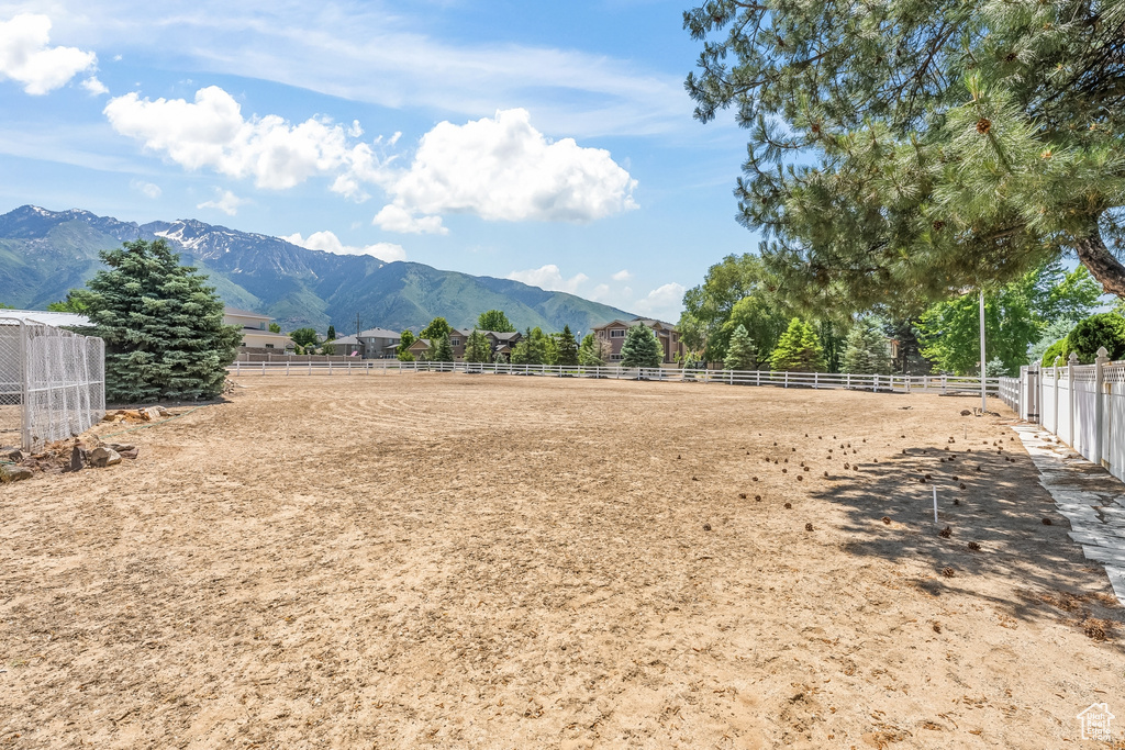 Property view of mountains with a rural view