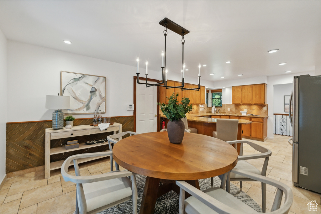 Dining space with wood walls and a barn door