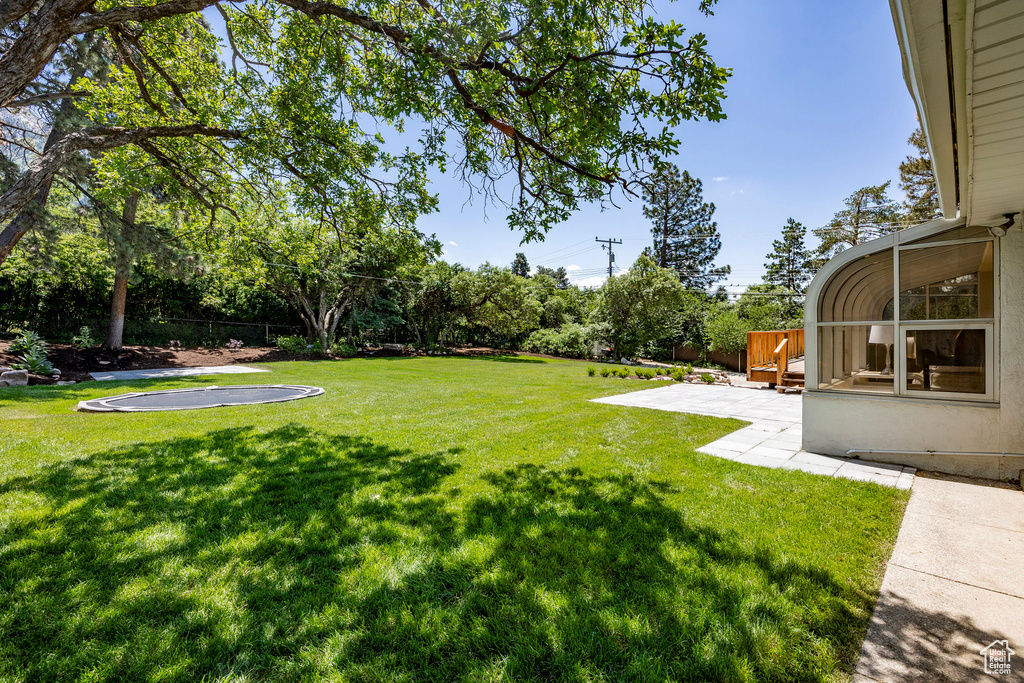 View of yard with a patio