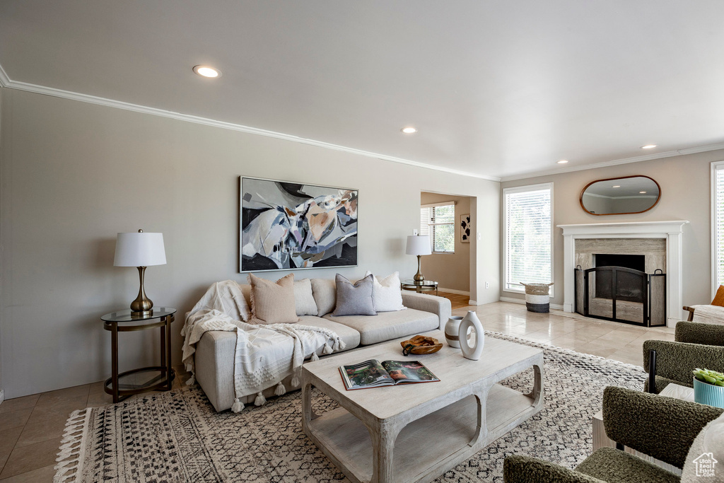 Living room with crown molding and tile flooring