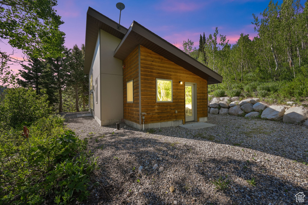 View of property exterior at dusk