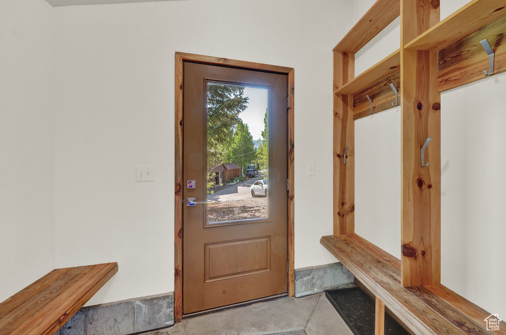 Mudroom featuring tile floors