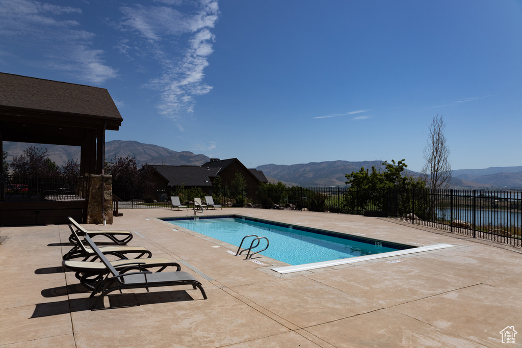 View of pool featuring a patio area and a mountain view