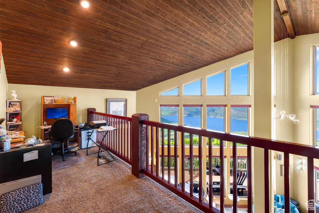 Office with high vaulted ceiling, carpet, and wood ceiling