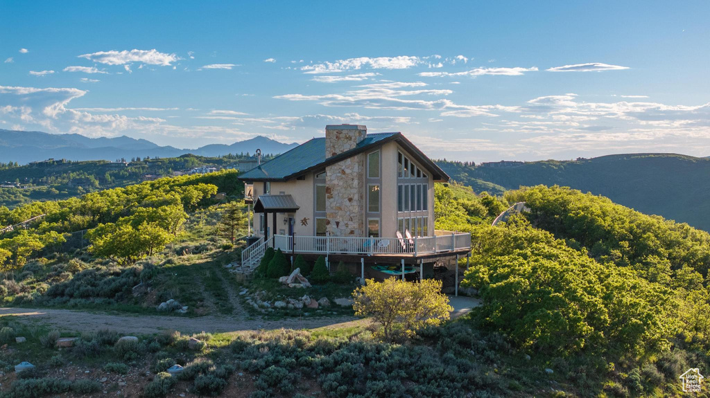 Back of property featuring a mountain view