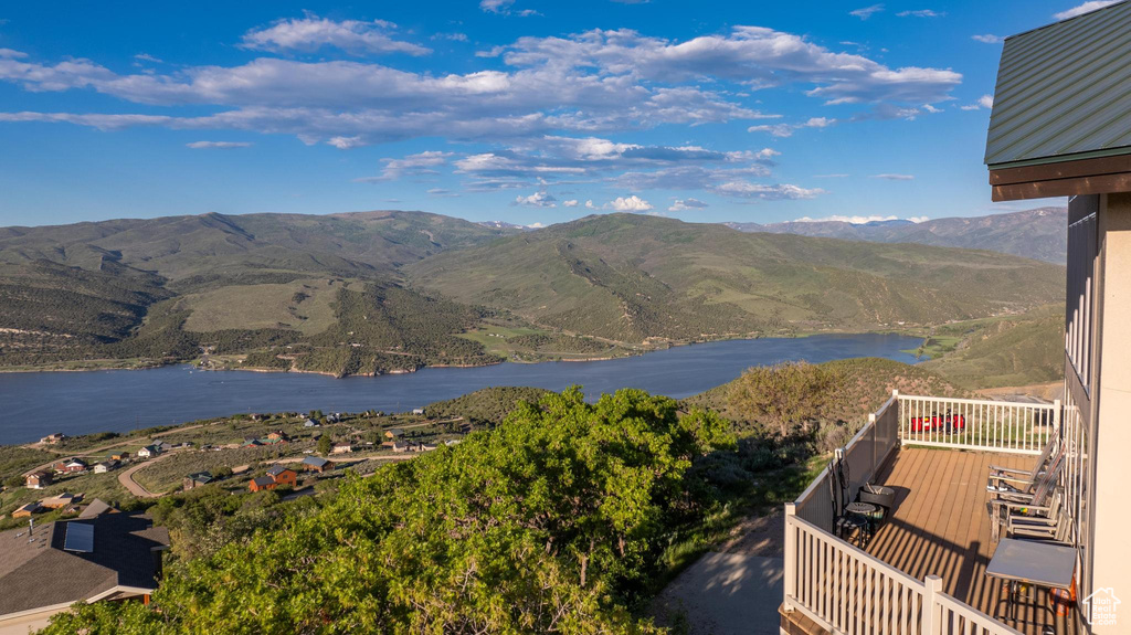 Property view of mountains featuring a water view