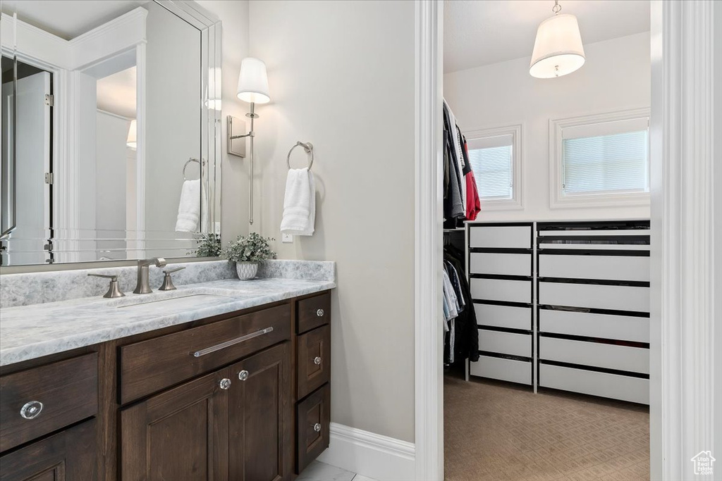 Bathroom with tile flooring and vanity