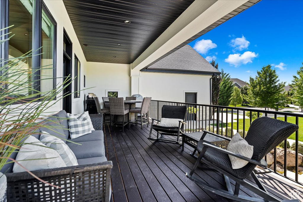 Wooden deck with an outdoor hangout area