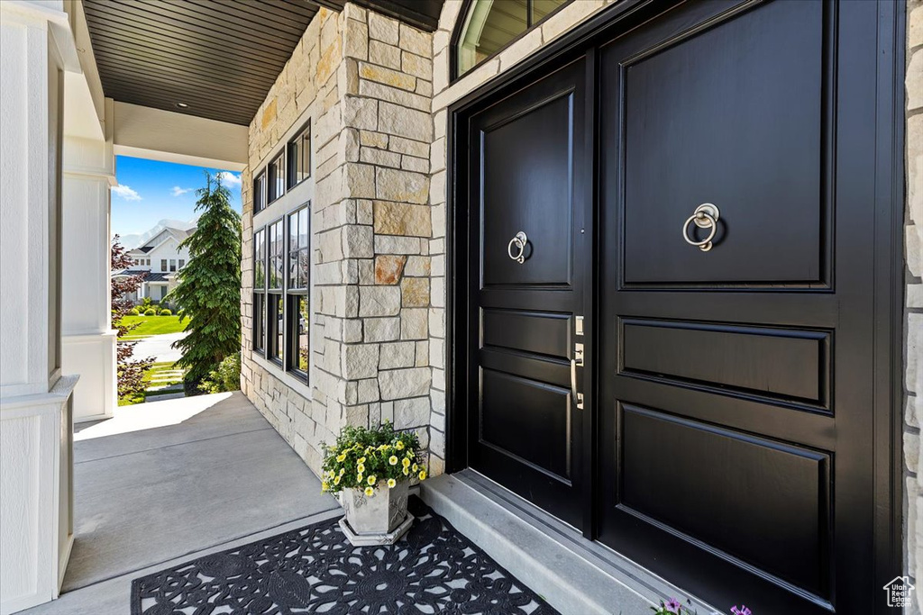 Doorway to property with covered porch