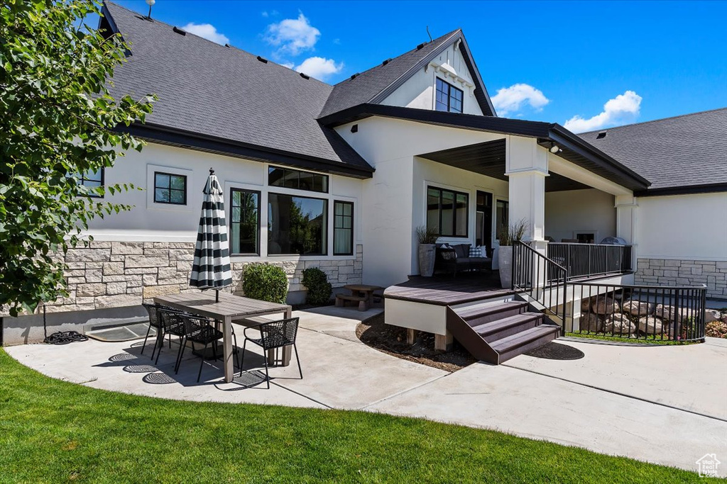 Rear view of house with a patio area