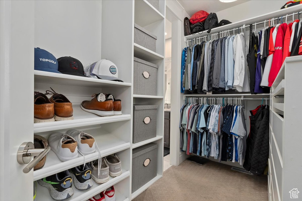 Walk in closet featuring carpet floors