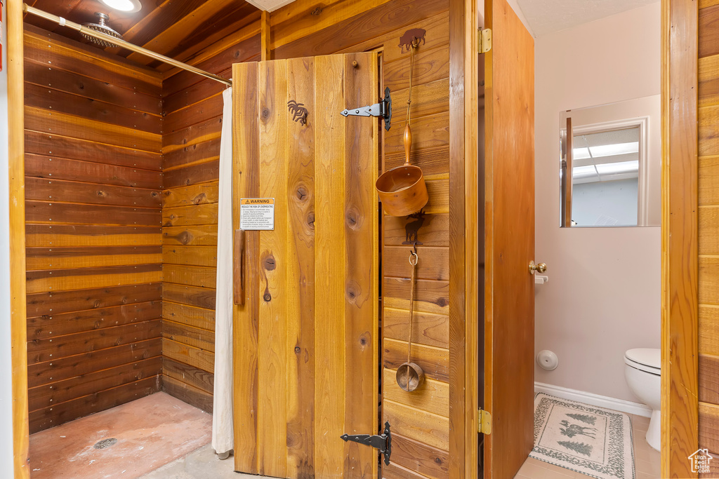 Bathroom with tile flooring and toilet