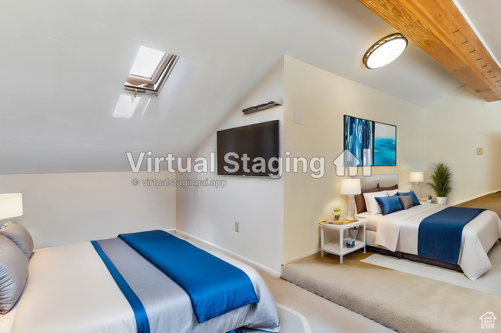 Carpeted bedroom with vaulted ceiling with skylight