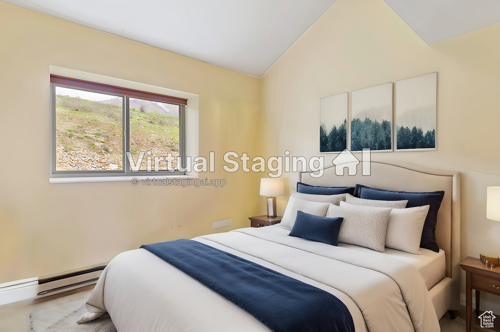 Bedroom featuring high vaulted ceiling and a baseboard heating unit