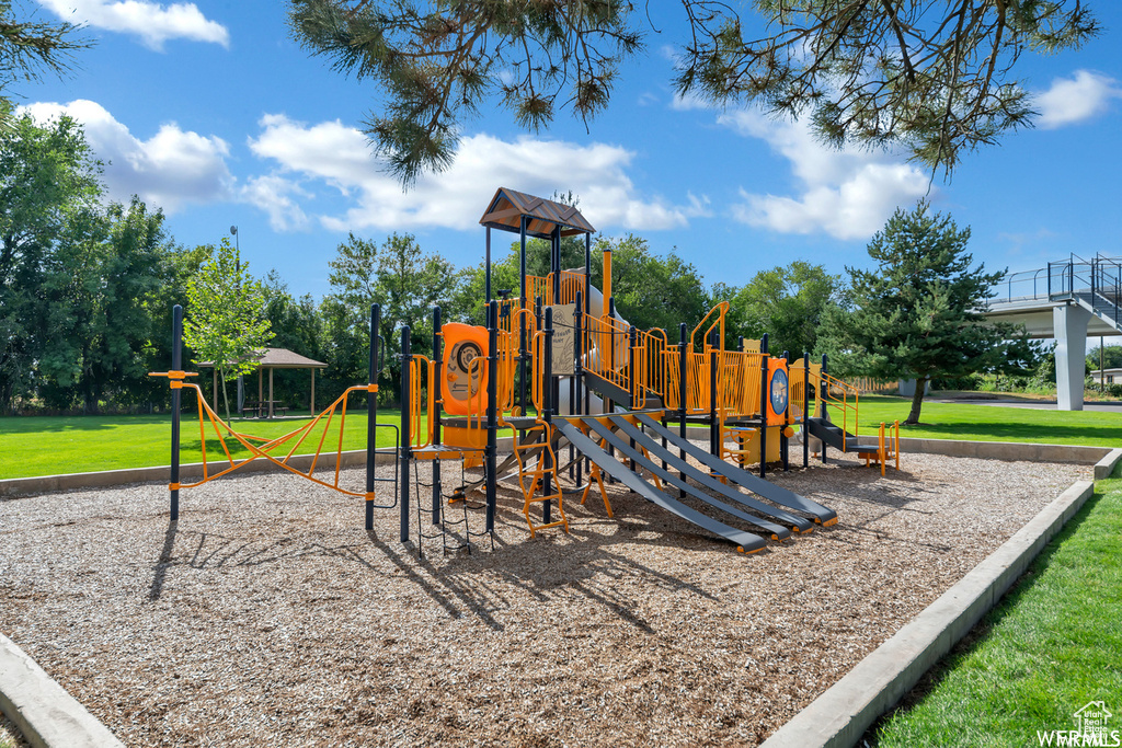 View of play area featuring a lawn