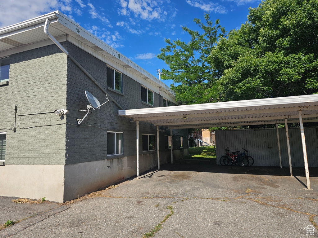 View of side of home with a carport