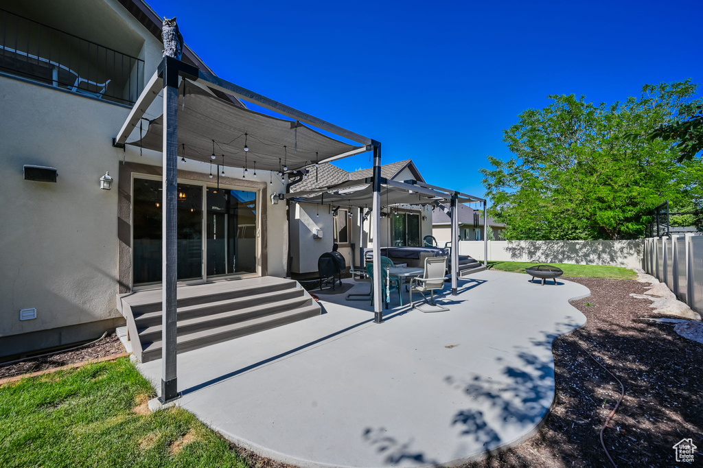 View of yard featuring a pergola and a patio area