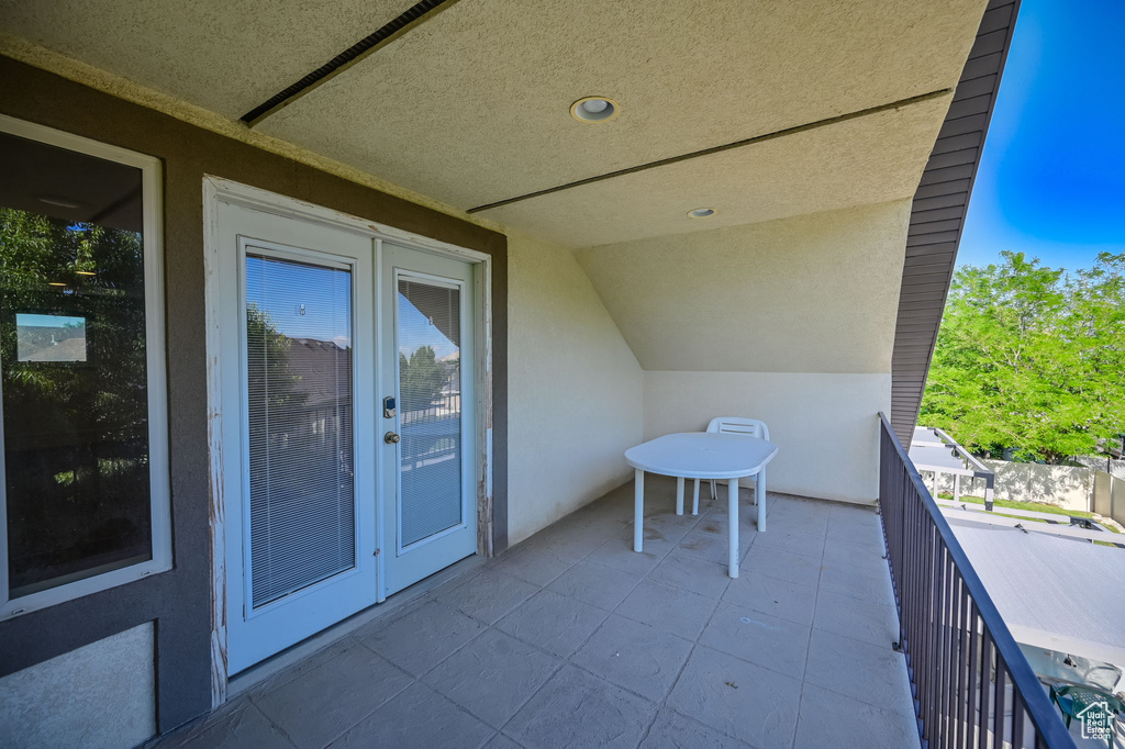 Balcony featuring french doors