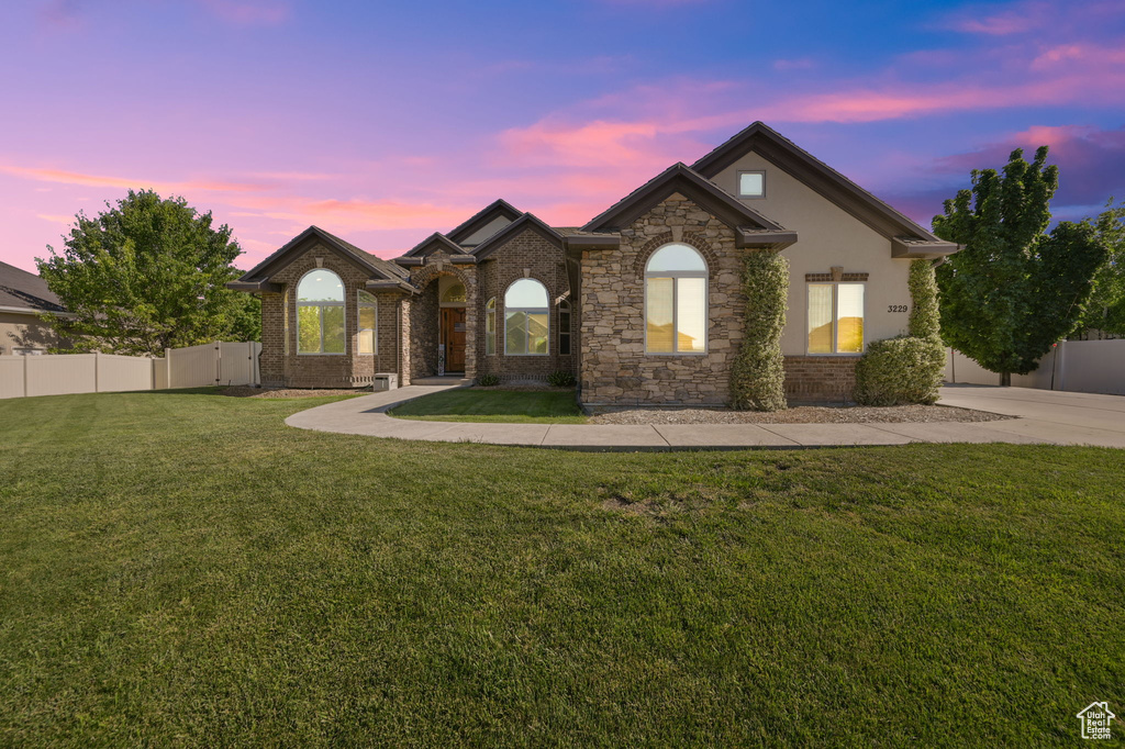 View of front of property with a lawn