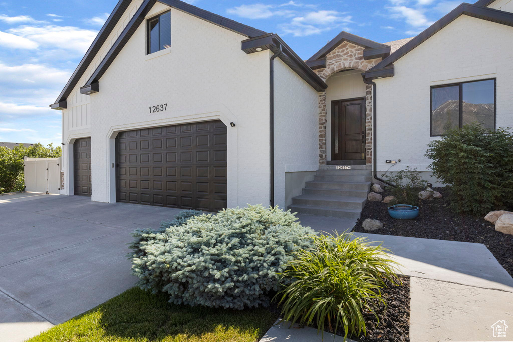 View of front of property featuring a garage