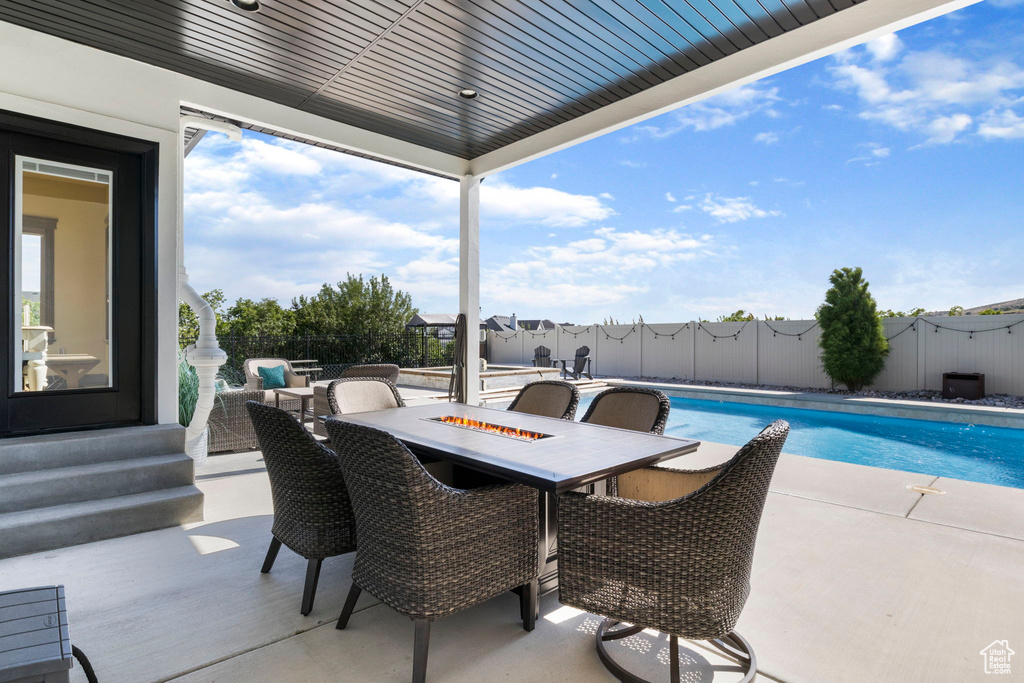 View of patio featuring a fenced in pool