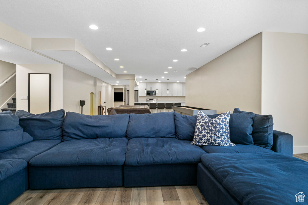 Living room with hardwood / wood-style floors