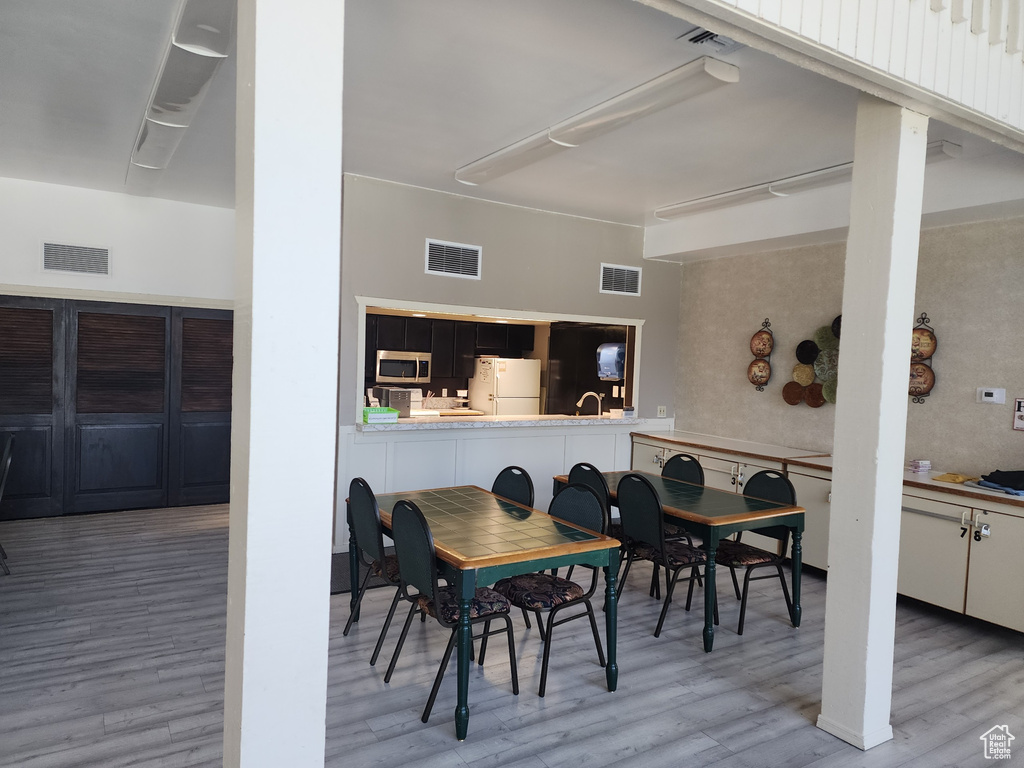 Dining room with hardwood / wood-style flooring