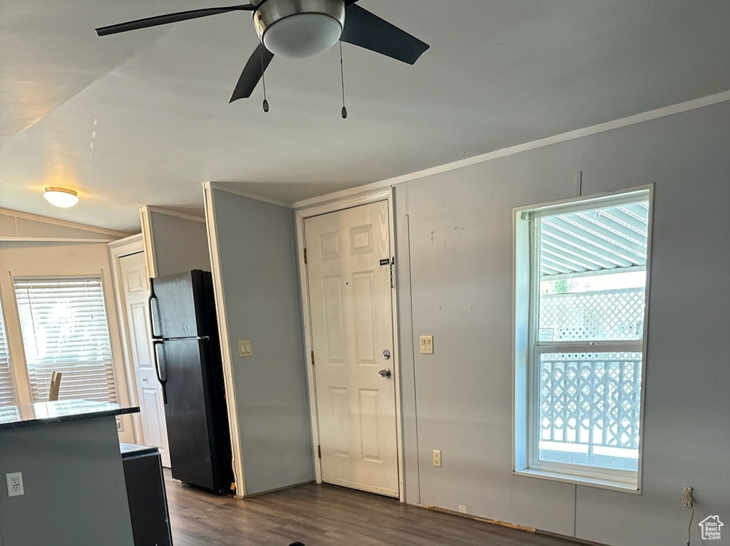 Living room featuring ornamental molding, dark hardwood / wood-style floors, and ceiling fan