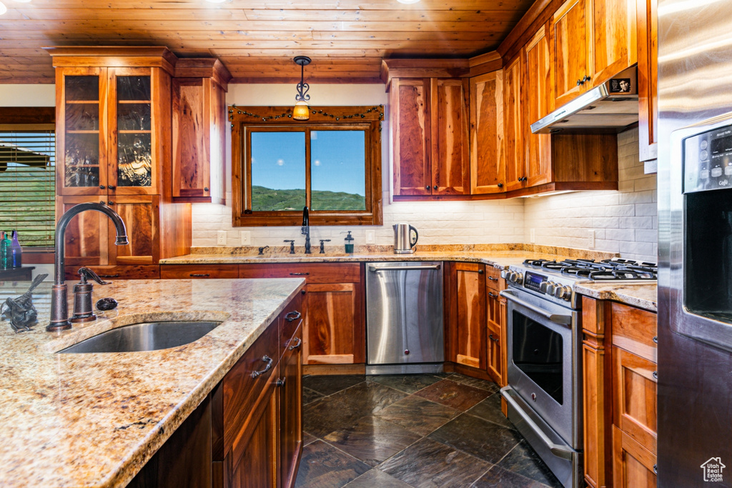 Kitchen with stainless steel appliances, wooden ceiling, backsplash, and pendant lighting