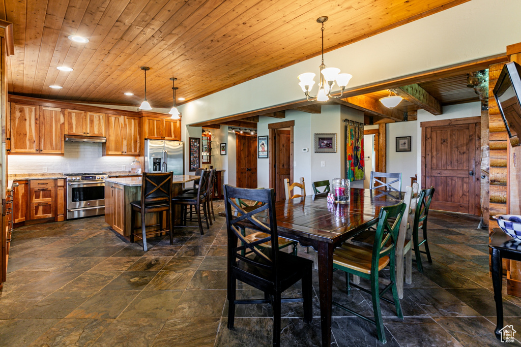 Tiled dining area with a chandelier and wooden ceiling