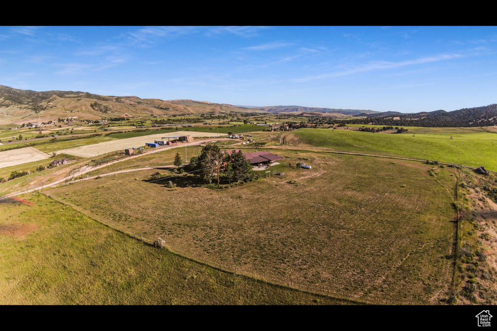 Drone / aerial view with a mountain view and a rural view