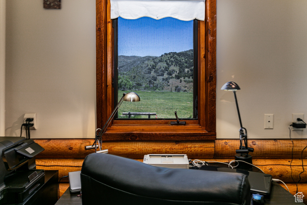 Interior space featuring a mountain view and log walls