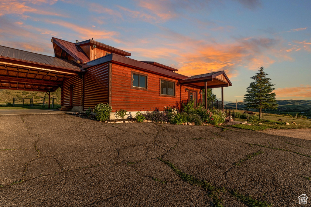 Property exterior at dusk with a carport