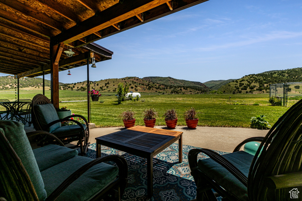 View of patio featuring a mountain view