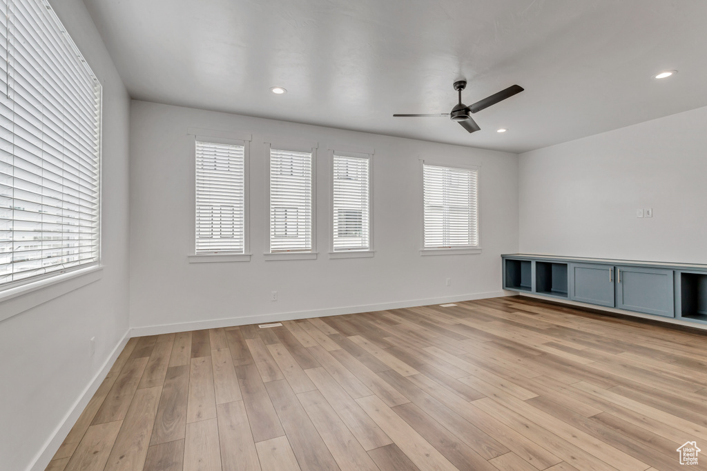 Spare room featuring ceiling fan and light hardwood / wood-style flooring