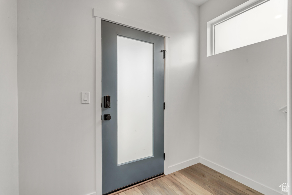 Doorway to outside featuring light hardwood / wood-style flooring