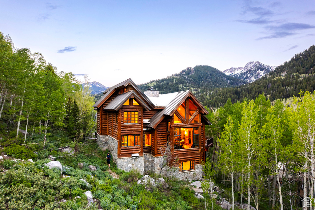 Rear view of house featuring a mountain view