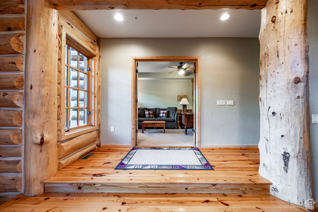 Entrance foyer featuring ceiling fan and light hardwood / wood-style floors