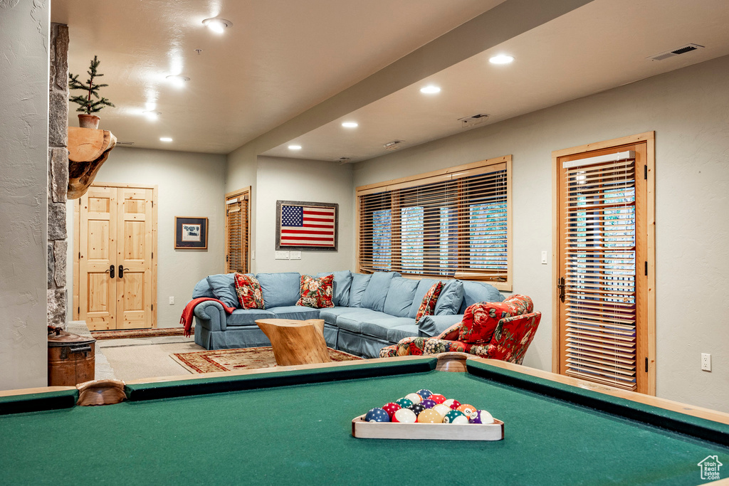 Recreation room with carpet flooring and pool table