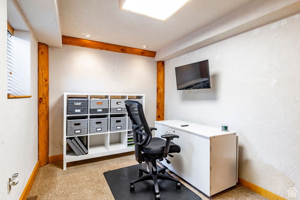 Office featuring beamed ceiling and baseboards