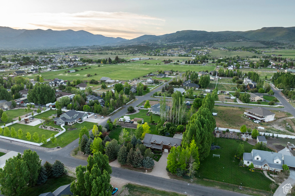 Aerial view of property\'s location featuring mountains and nearby suburban area