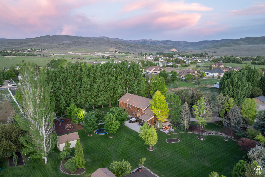 Aerial view of property\'s location with a mountainous background
