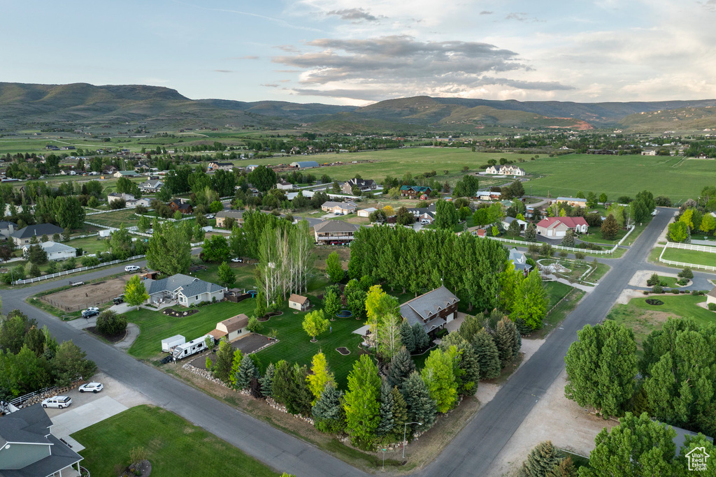 Aerial view of property\'s location with a mountainous background and nearby suburban area