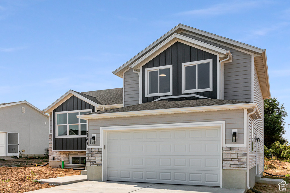 View of front of home featuring a garage