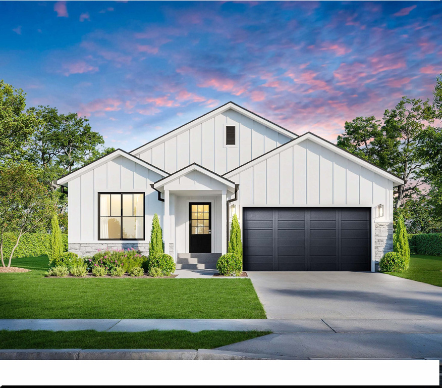 Modern farmhouse style home with a garage and a lawn