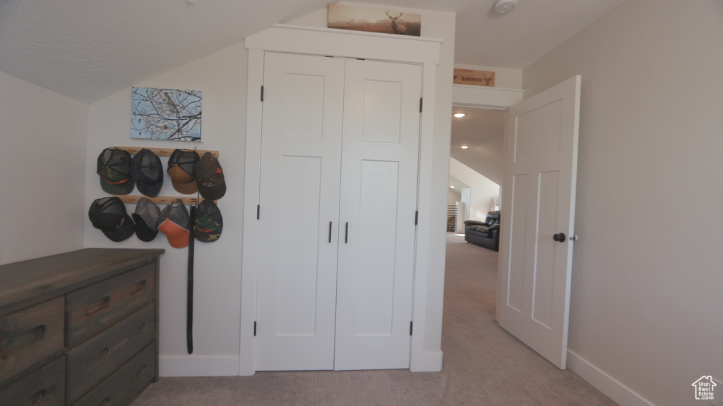 Bedroom featuring carpet flooring and a closet