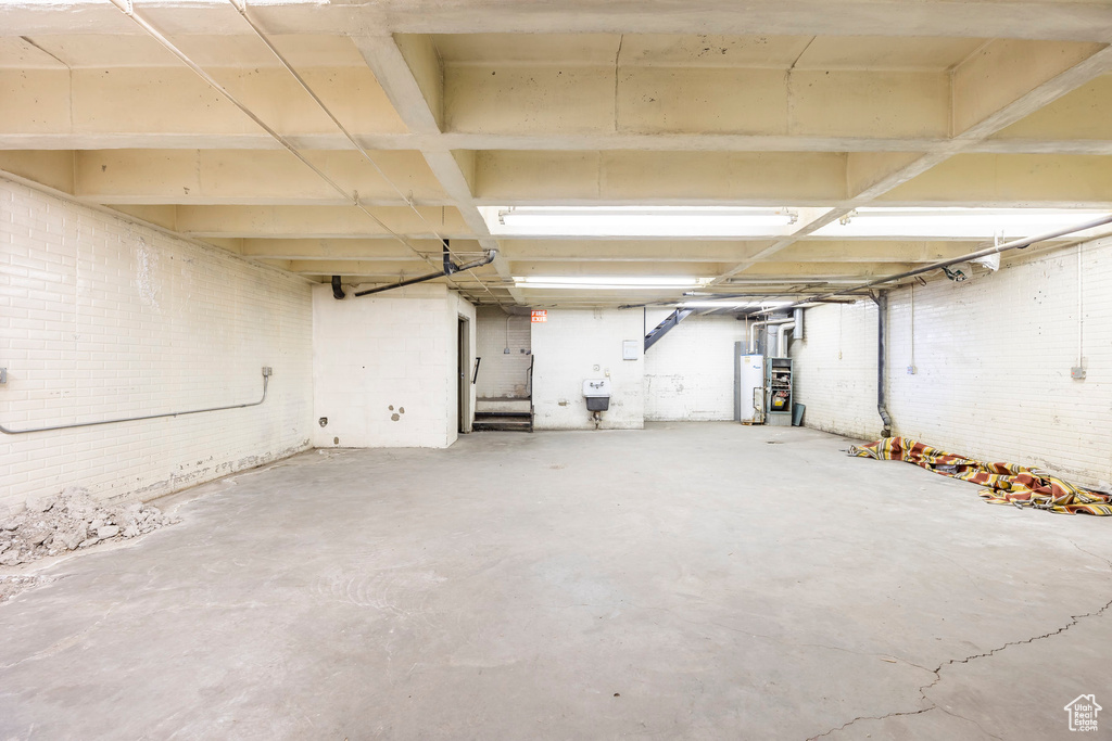 Basement featuring water heater