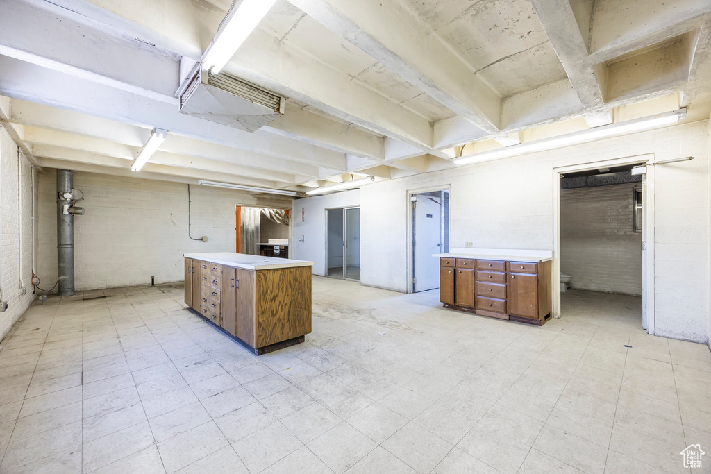 Basement featuring light tile floors