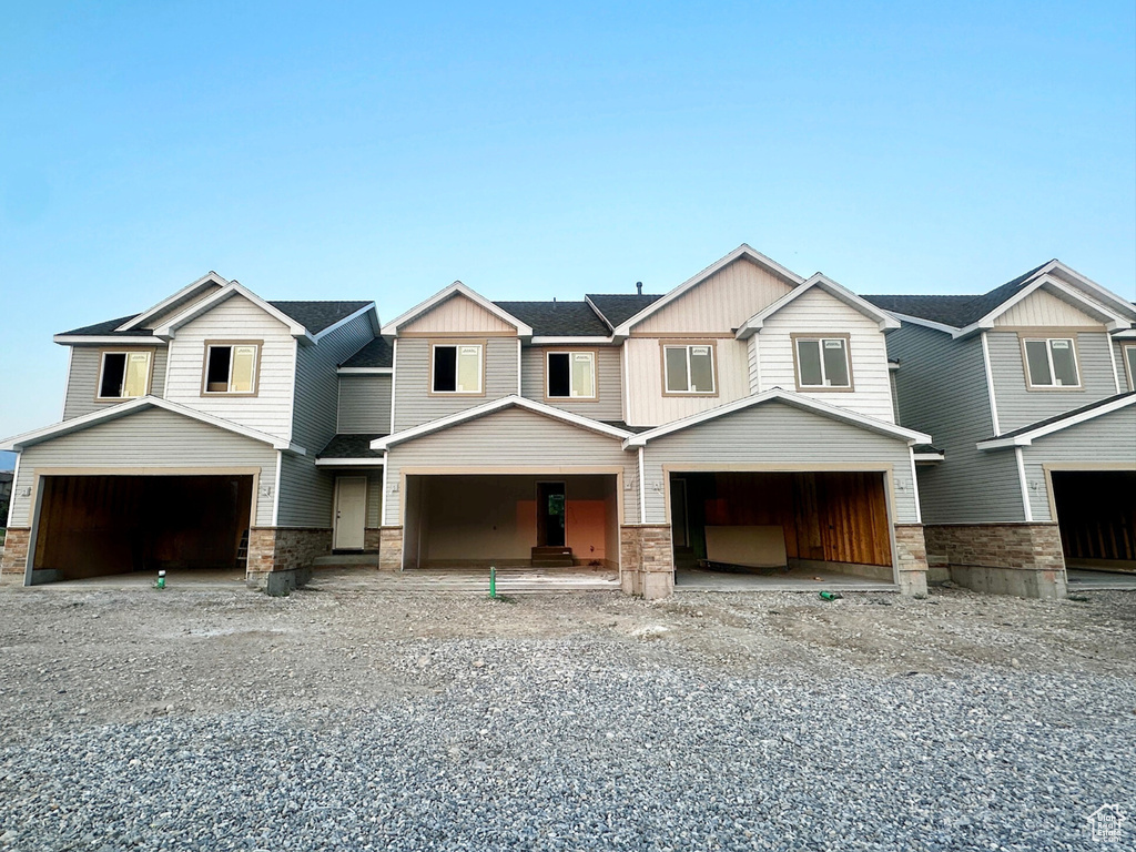 View of front facade featuring a garage